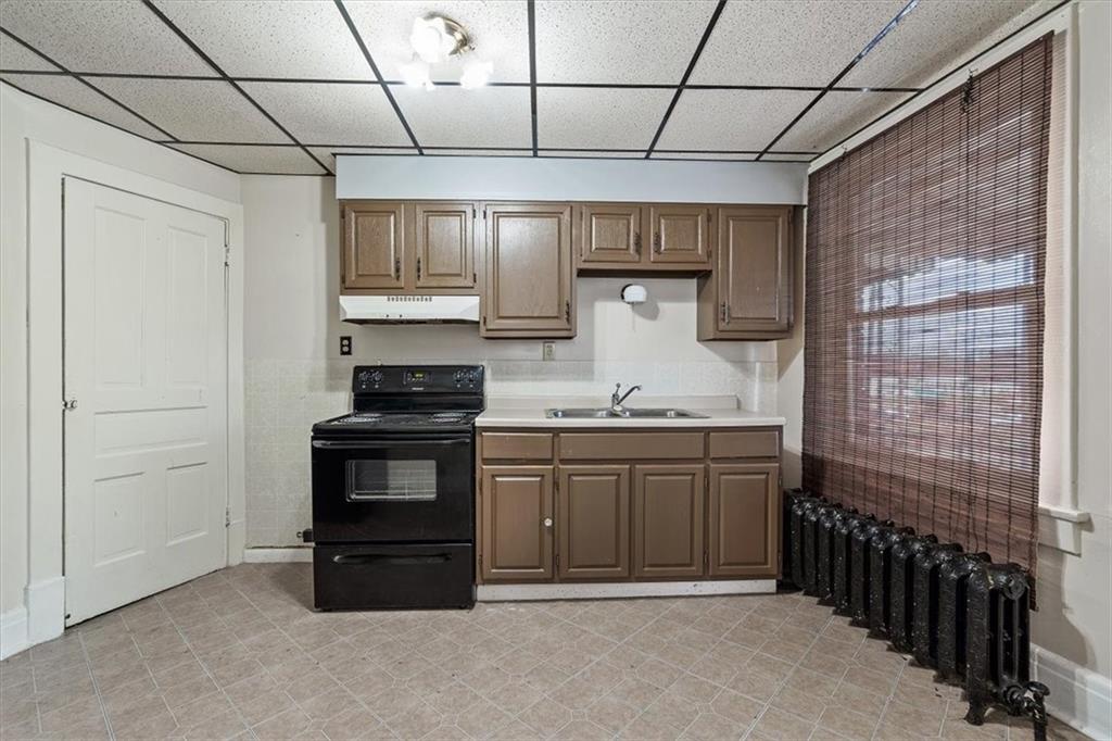 701 Freeport Road Creighton, PA 15030 - Photo 6 of 26 a kitchen with stainless steel appliances granite countertop a stove and a refrigerator