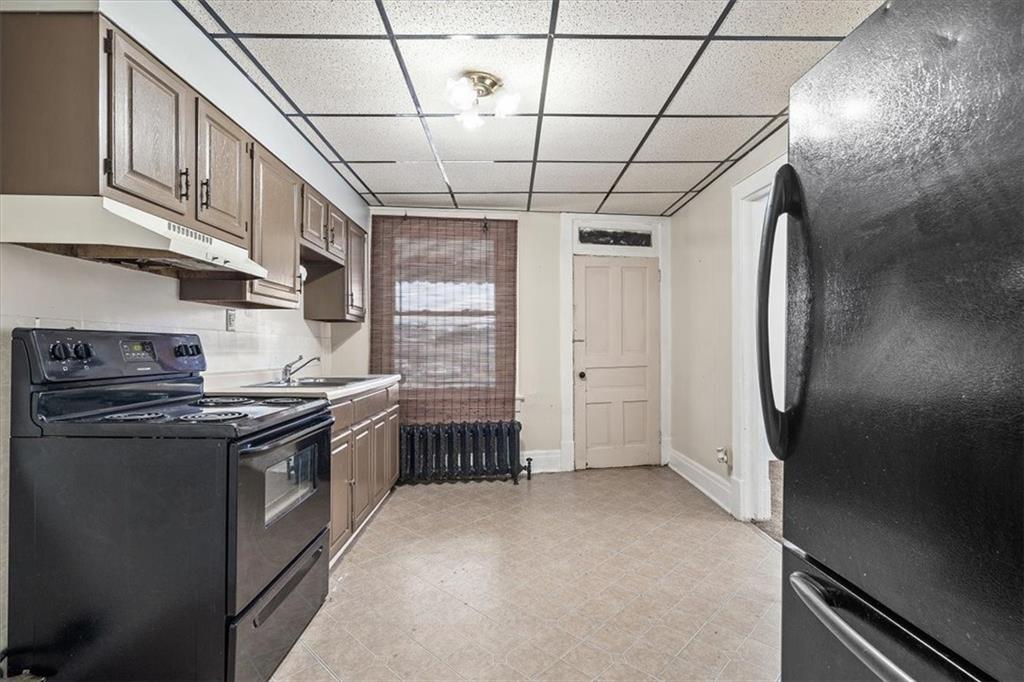 701 Freeport Road Creighton, PA 15030 - Photo 7 of 26 a kitchen with stainless steel appliances granite countertop a stove a refrigerator and a sink