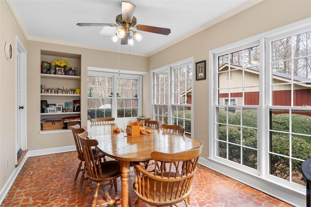455 M M Sanders Road Buchanan, GA 30113 - Photo 11 of 65 a dining room with furniture a window and a chandelier
