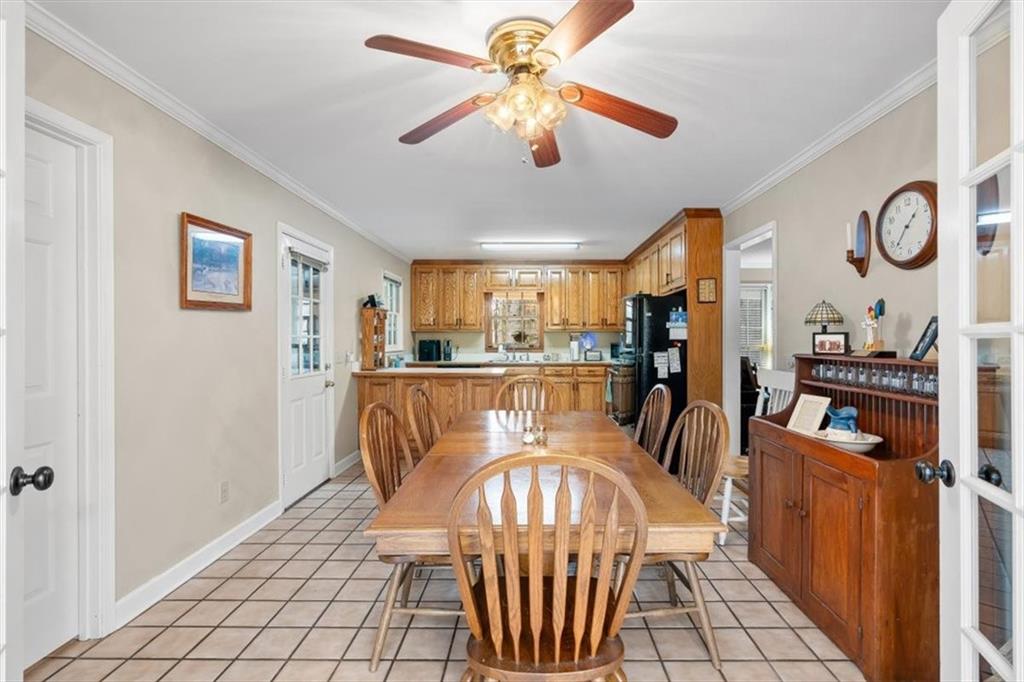 455 M M Sanders Road Buchanan, GA 30113 - Photo 14 of 65 a dining room with furniture a rug a rug and a chandelier