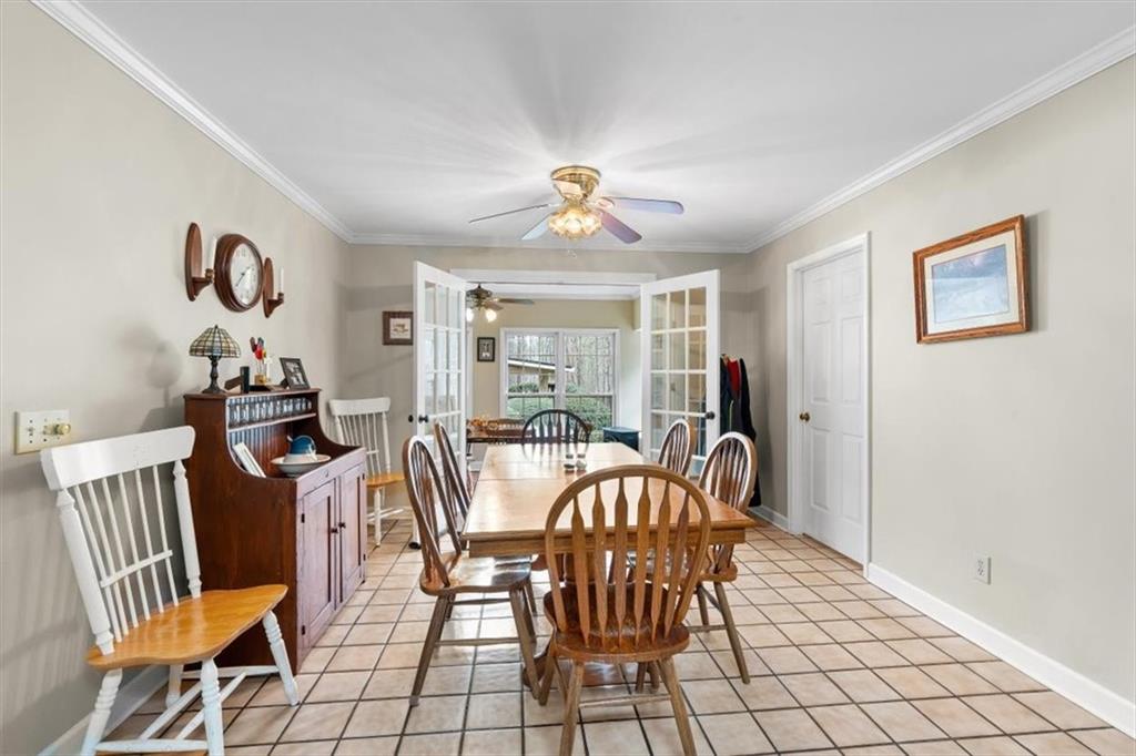 455 M M Sanders Road Buchanan, GA 30113 - Photo 15 of 65 a view of a dining room with furniture and chandelier