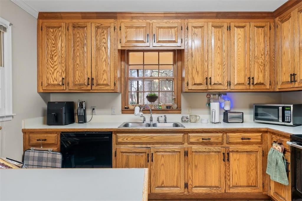 455 M M Sanders Road Buchanan, GA 30113 - Photo 17 of 65 a kitchen with stainless steel appliances granite countertop a stove a sink and a microwave
