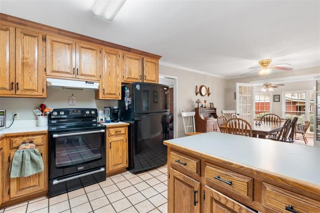 455 M M Sanders Road Buchanan, GA 30113 - Photo 20 of 65 a kitchen with stainless steel appliances granite countertop a refrigerator and a stove top oven