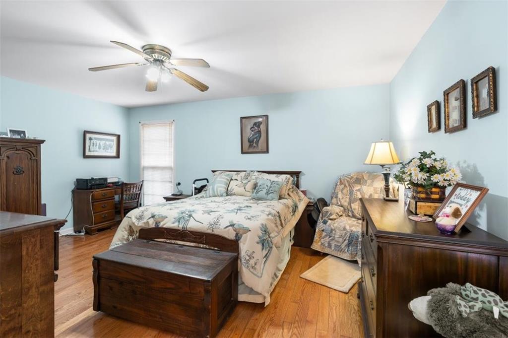 455 M M Sanders Road Buchanan, GA 30113 - Photo 26 of 65 a bedroom with bed and a chandelier