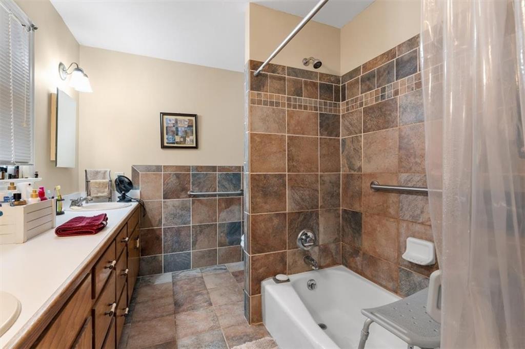 455 M M Sanders Road Buchanan, GA 30113 - Photo 29 of 65 a bathroom with a tub shower and a sink