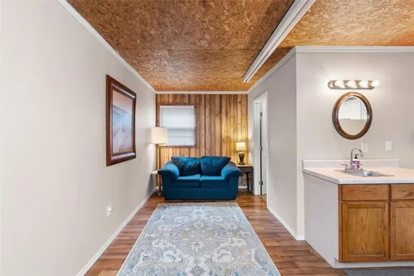 a view of an entryway with wooden floor and windows