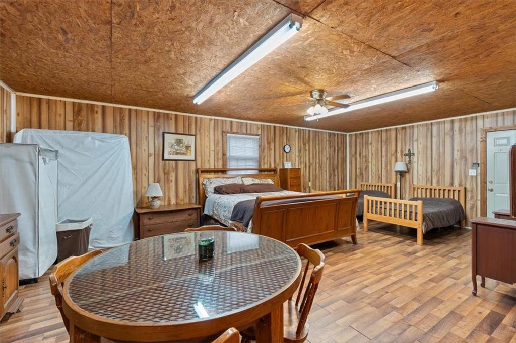 455 M M Sanders Road Buchanan, GA 30113 - Photo 37 of 65 a dining room with furniture and a chandelier