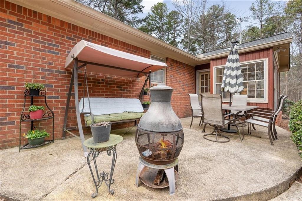 455 M M Sanders Road Buchanan, GA 30113 - Photo 45 of 65 a view of a chairs and tables in patio