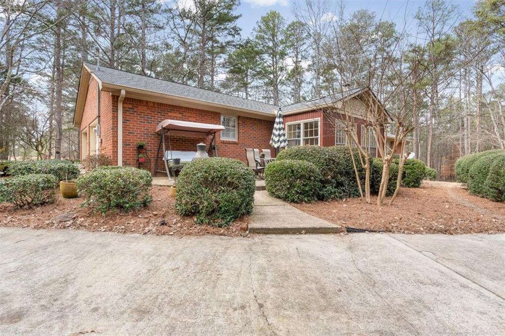 455 M M Sanders Road Buchanan, GA 30113 - Photo 46 of 65 a front view of house with yard and trees around