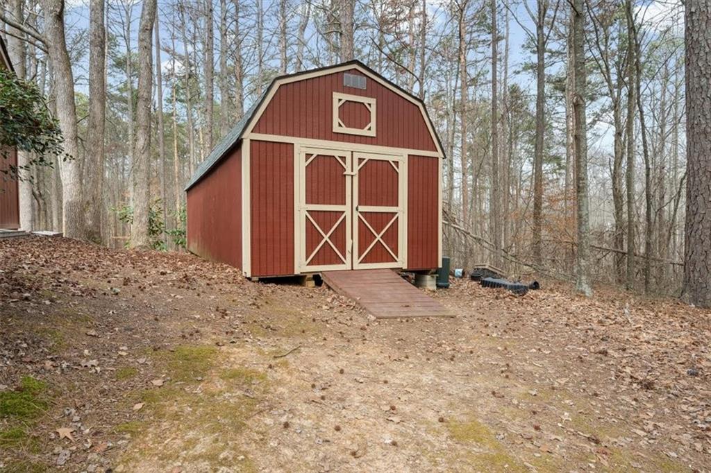 455 M M Sanders Road Buchanan, GA 30113 - Photo 49 of 65 a view of a house with a yard