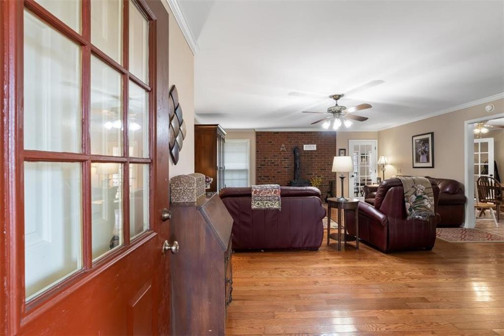 455 M M Sanders Road Buchanan, GA 30113 - Photo 5 of 65 a living room with furniture and a chandelier