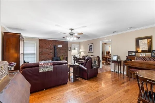 a living room with furniture rug and window
