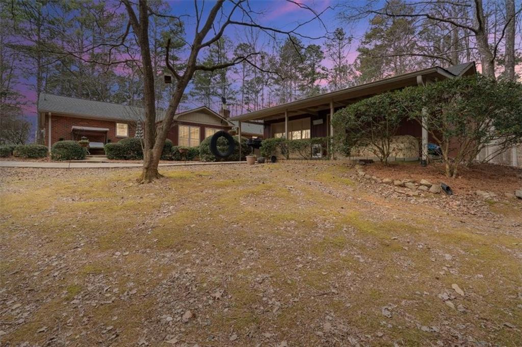 455 M M Sanders Road Buchanan, GA 30113 - Photo 64 of 65 a view of a large house with a large tree