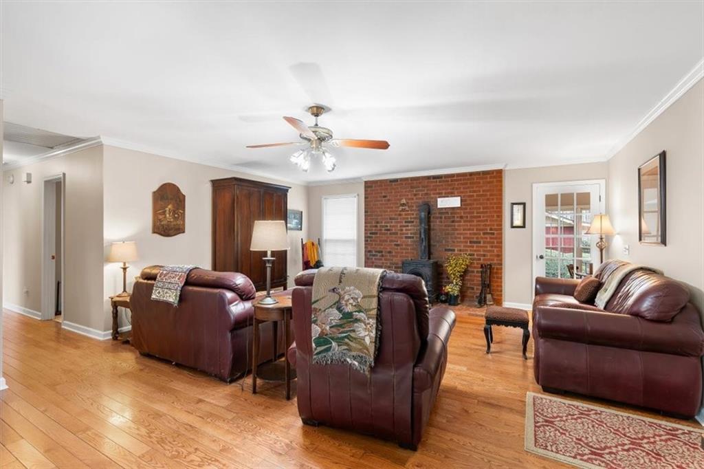 455 M M Sanders Road Buchanan, GA 30113 - Photo 7 of 65 a living room with furniture ceiling fan and a rug