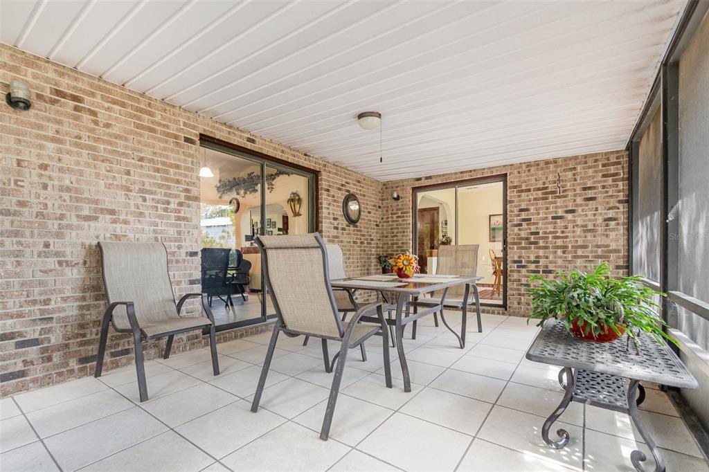 155 11th Avenue Osteen, FL 32764 - Photo 21 of 42 a view of a dining room with furniture and outside view