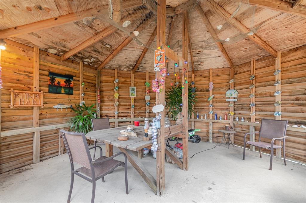 155 11th Avenue Osteen, FL 32764 - Photo 31 of 42 a view of a patio with table and chairs and potted plants