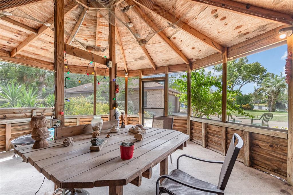 155 11th Avenue Osteen, FL 32764 - Photo 32 of 42 a view of a city from a dining room with large windows and furniture