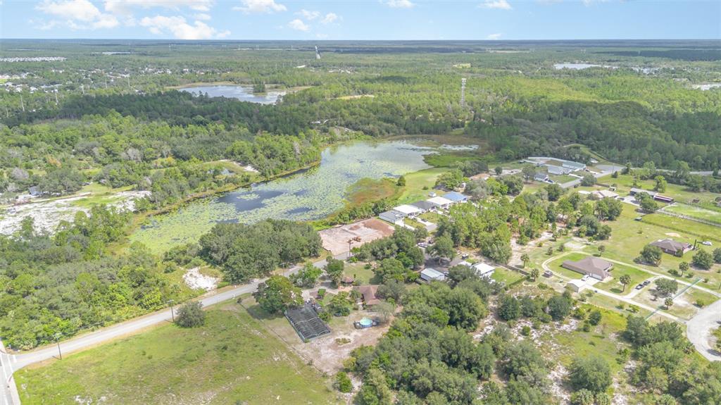 155 11th Avenue Osteen, FL 32764 - Photo 40 of 42 a view of lake with green space