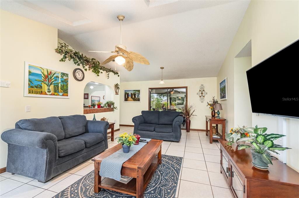 155 11th Avenue Osteen, FL 32764 - Photo 8 of 42 a living room with furniture and a flat screen tv
