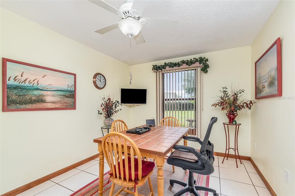 155 11th Avenue Osteen, FL 32764 - Photo 9 of 42 a dining room with furniture and window