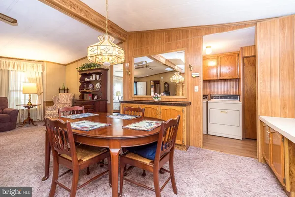 a dining room with furniture and window