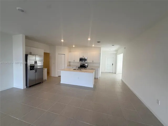 a view of a kitchen with kitchen and a window