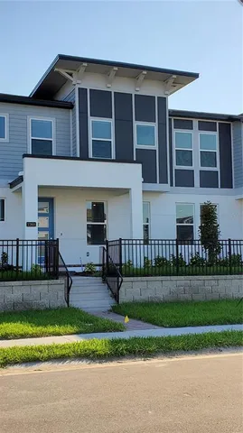 a front view of a house with a yard and a table