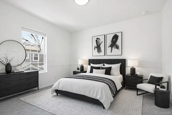 a bedroom with bed and a window