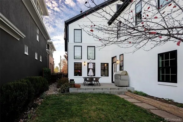 a view of backyard with patio