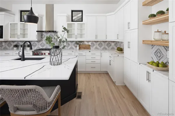 a kitchen with a sink cabinets and wooden floor