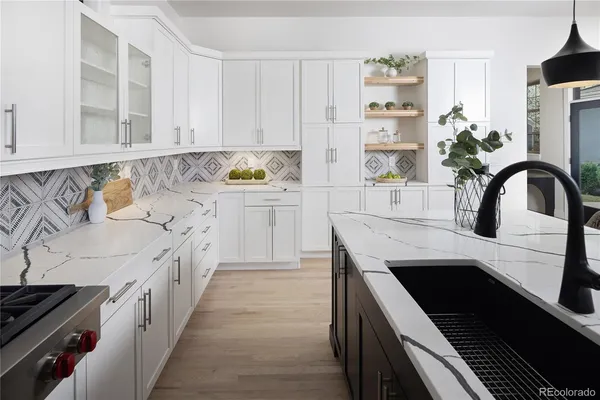 a kitchen with a sink and cabinets