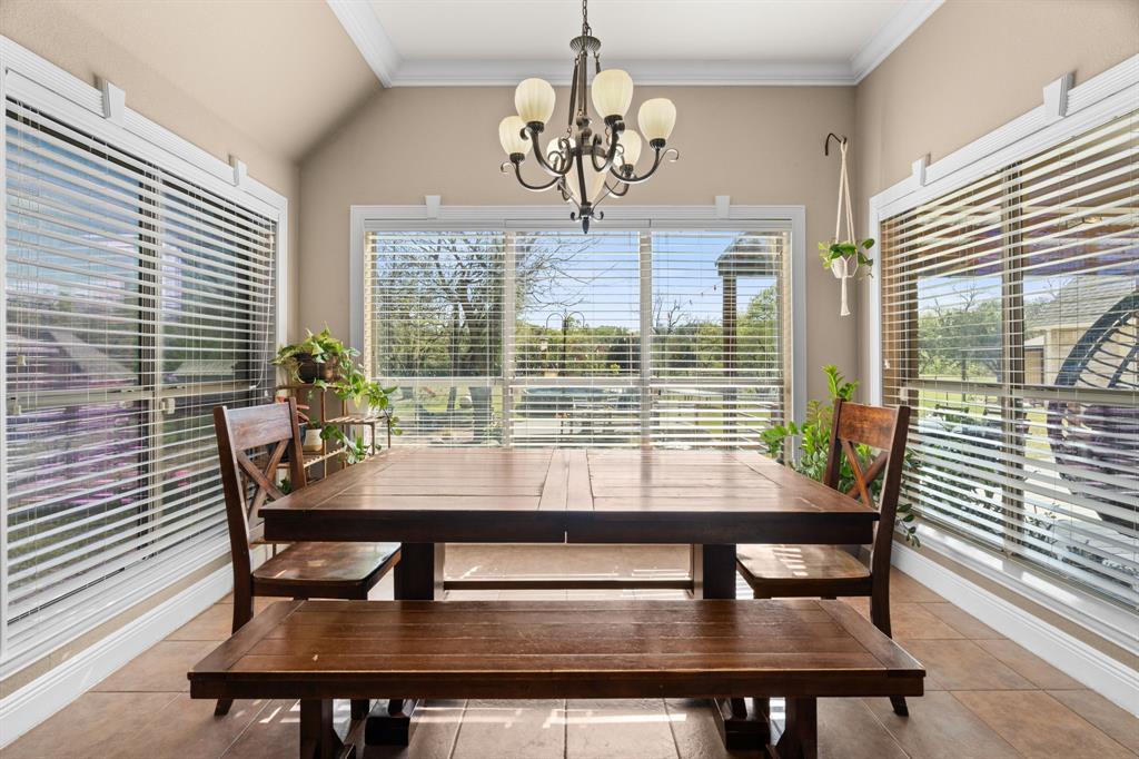 112 Waterfall Court Azle, TX 76020 - Photo 15 of 40 a view of a dining room with furniture and window
