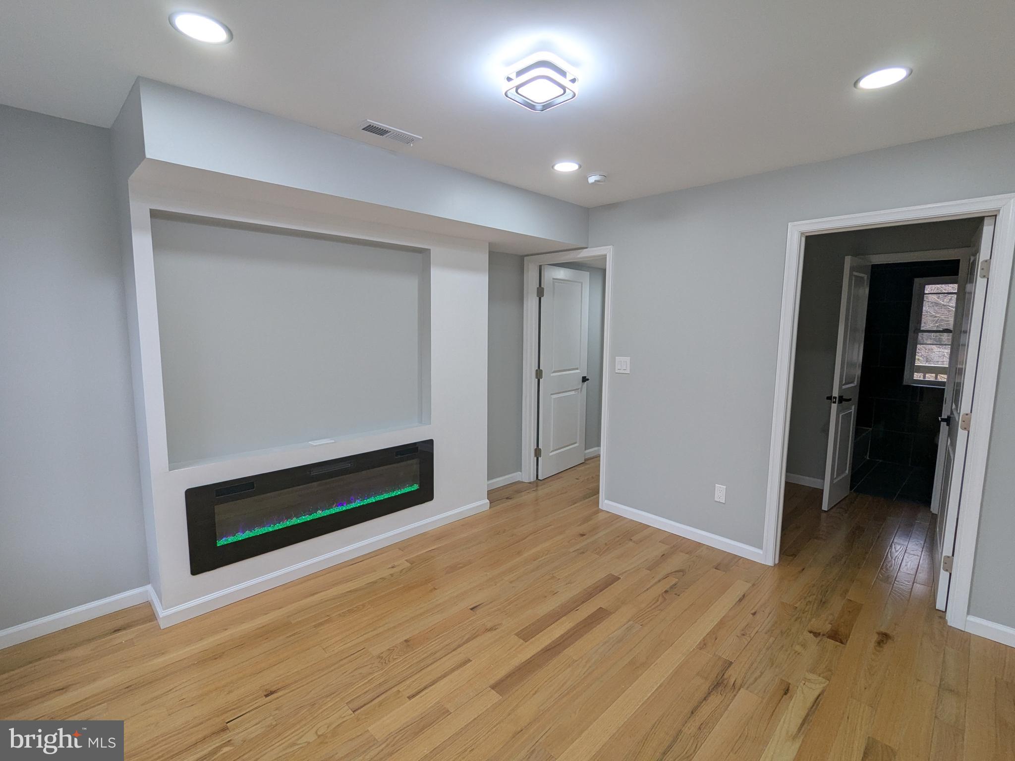 504 North Schroeder Street Baltimore, MD 21223 - Photo 11 of 32 a view of an empty room and wooden floor