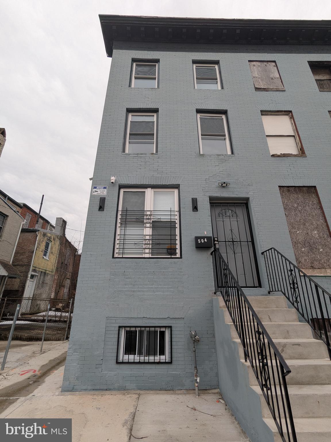 504 North Schroeder Street Baltimore, MD 21223 - Photo 2 of 32 a front view of a house with stairs