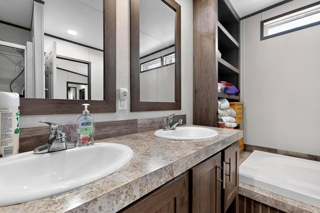 8450 North Farm To Market 148 Terrell, TX 75160 - Photo 20 of 38 Full bathroom featuring double vanity and a bath