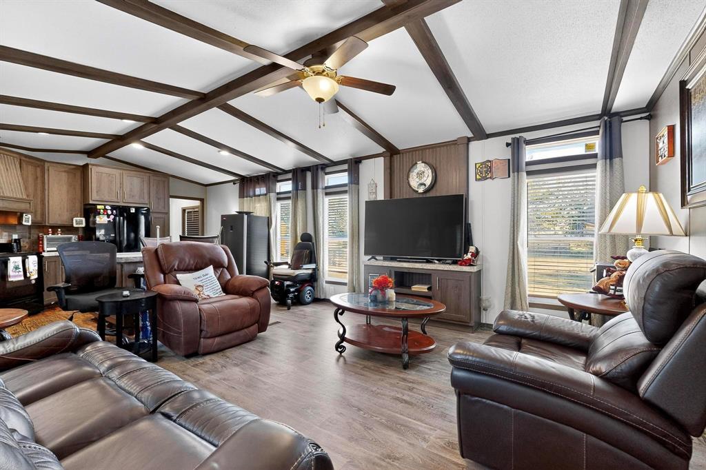 8450 North Farm To Market 148 Terrell, TX 75160 - Photo 8 of 38 Living room featuring healthy amount of natural light, light wood-type flooring, and ceiling fan