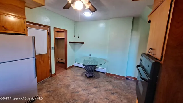 a bathroom with a sink and a refrigerator