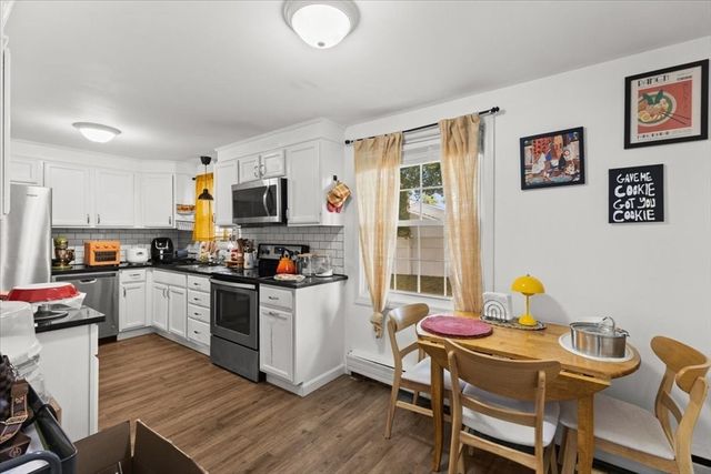 a kitchen with a sink cabinets and window