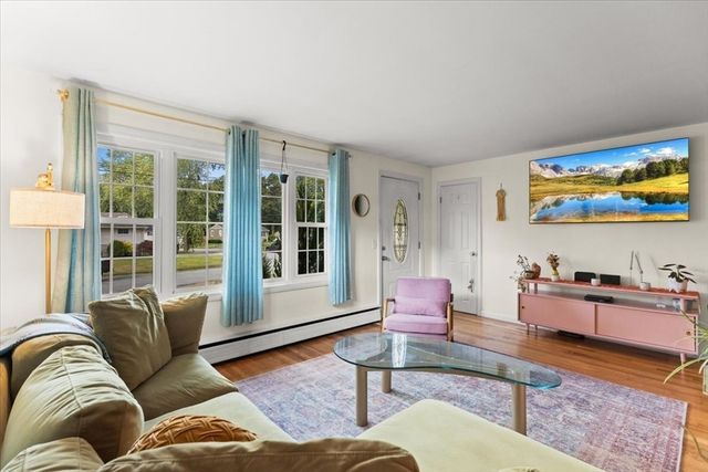 a living room with furniture or couch and a flat screen tv