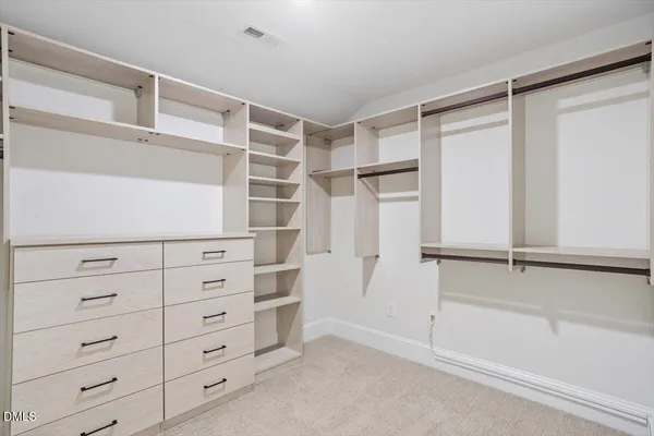 a view of an empty walk in closet