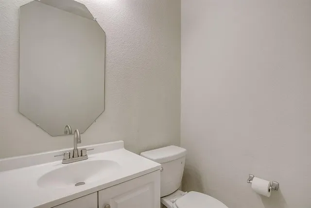 a bathroom with a sink a toilet