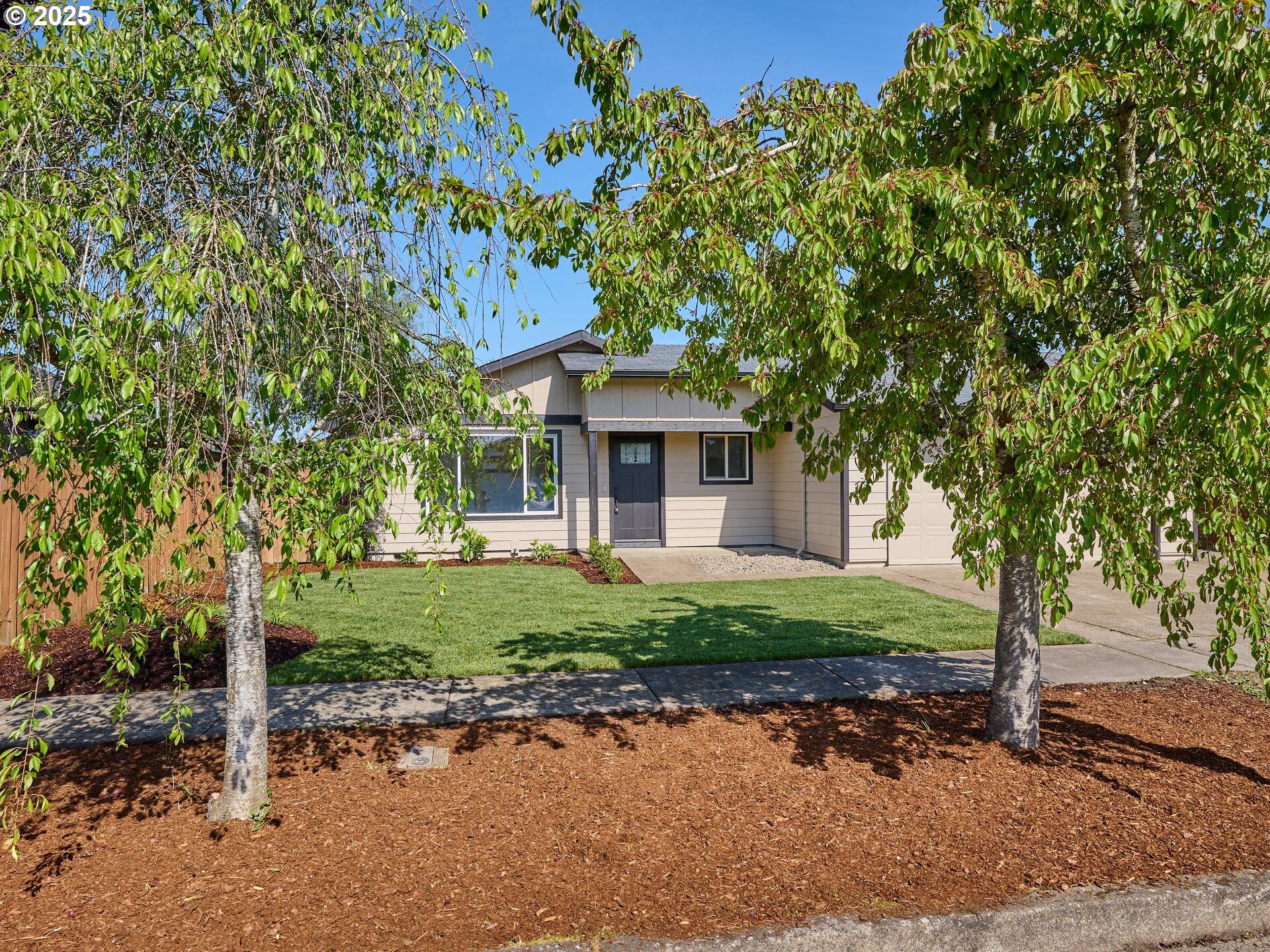 175 7th Street Gervais, OR 97026 - Photo 2 of 24 a front view of a house with a garden