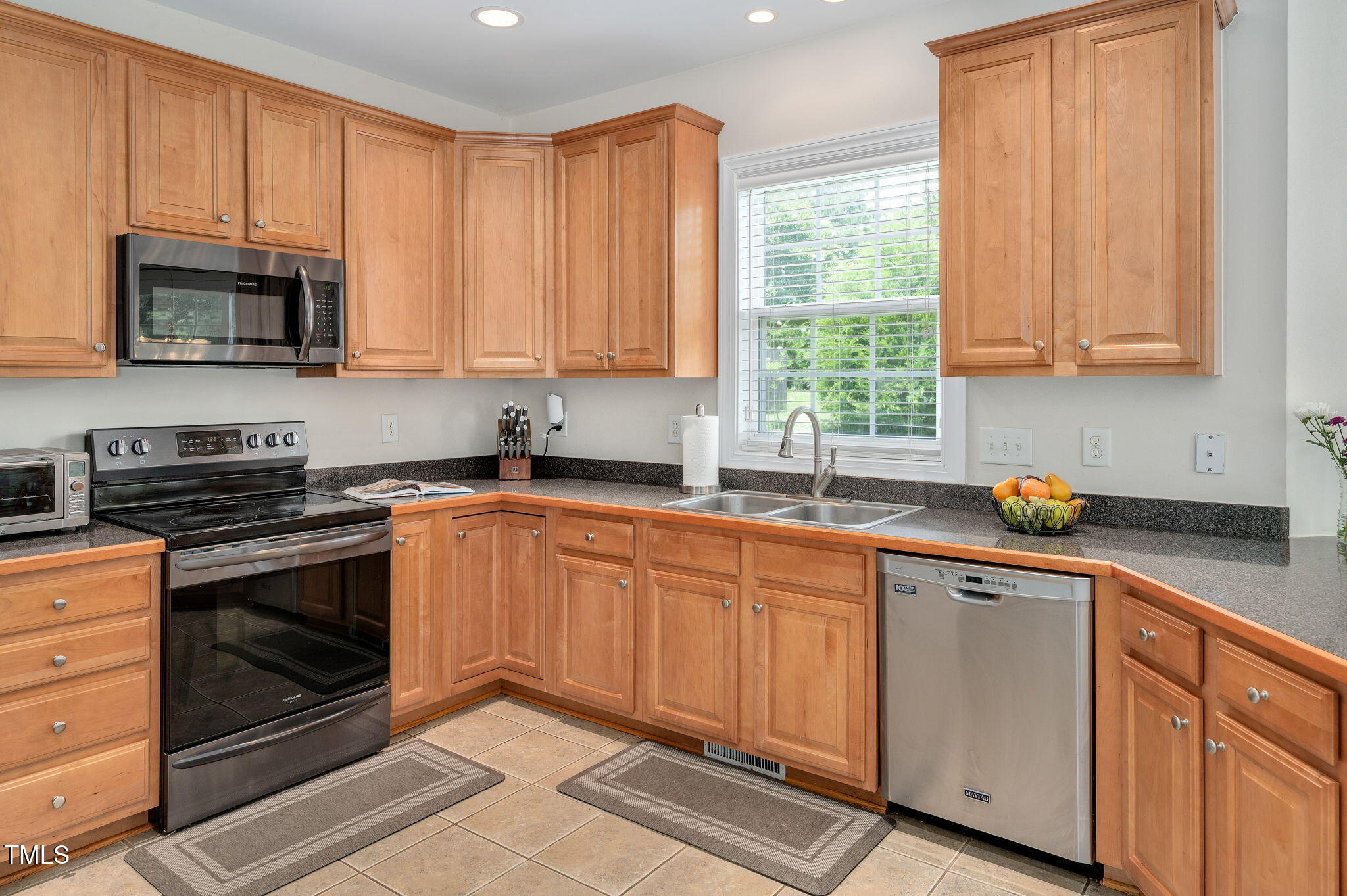 1106 Bellenden Drive Durham, NC 27713 - Photo 15 of 40 a kitchen with stainless steel appliances granite countertop white cabinets a sink and a stove