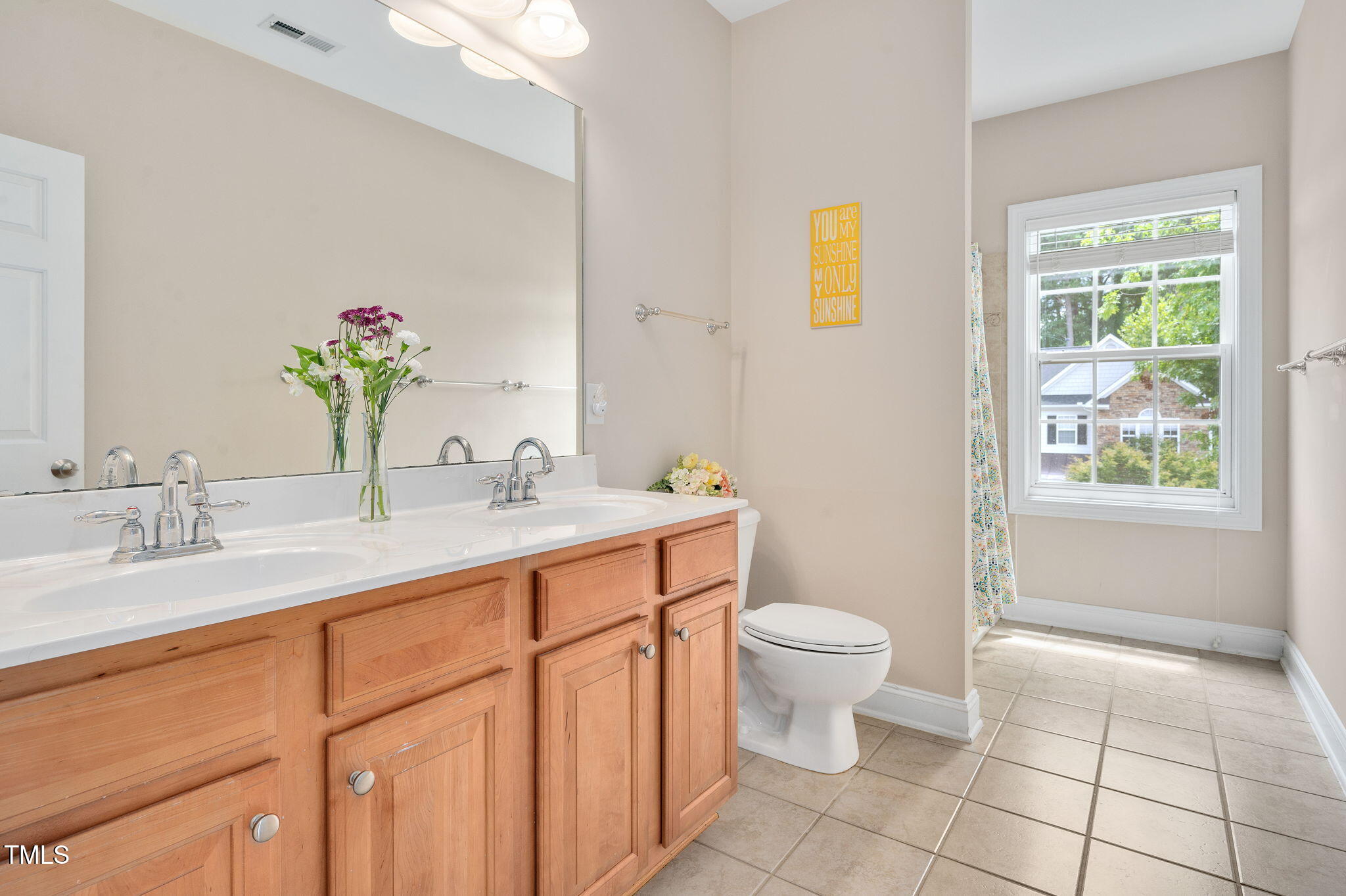 1106 Bellenden Drive Durham, NC 27713 - Photo 23 of 40 a bathroom with a granite countertop sink a toilet and a mirror