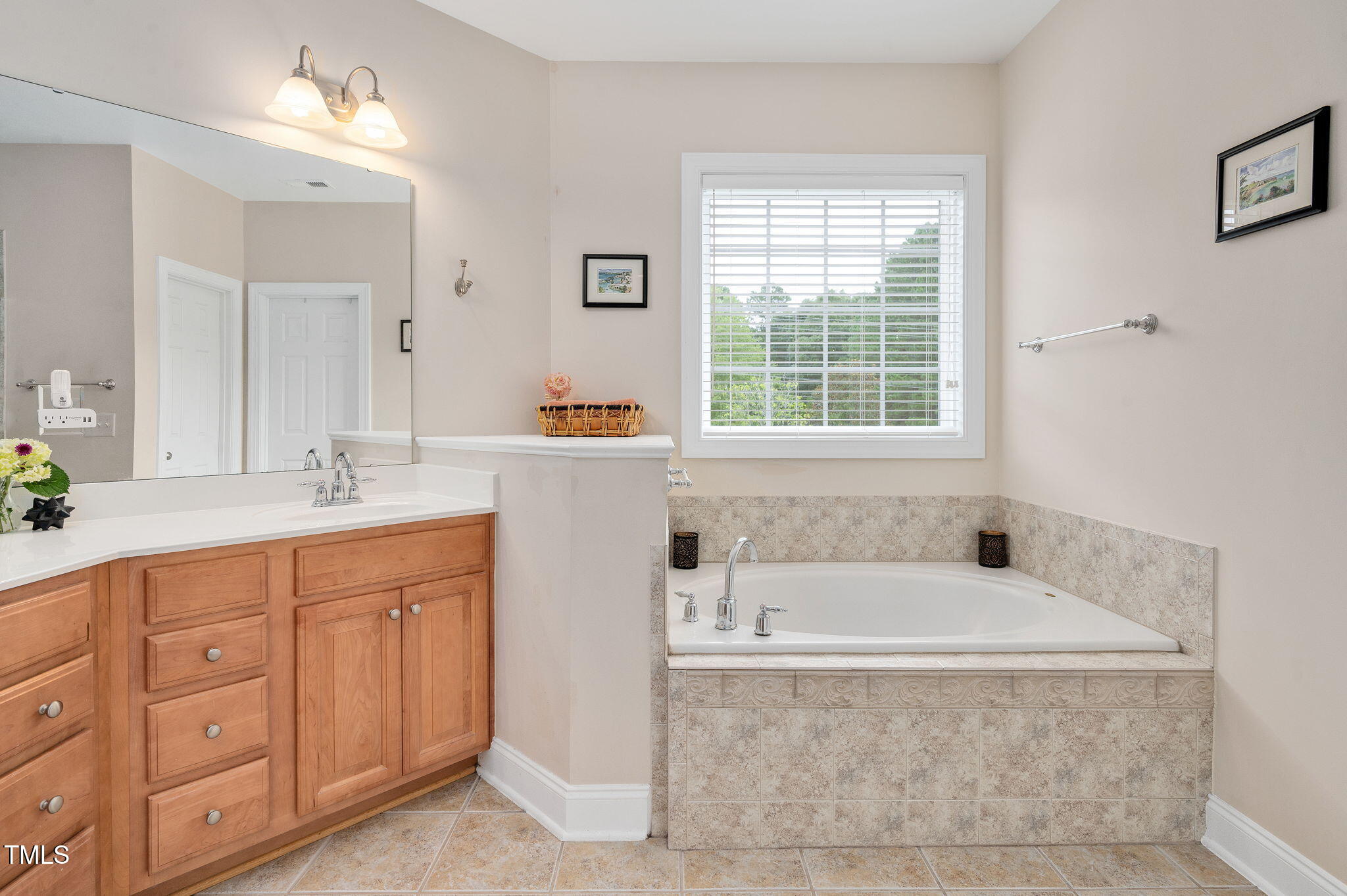 1106 Bellenden Drive Durham, NC 27713 - Photo 28 of 40 a bathroom with sink bathtub and window