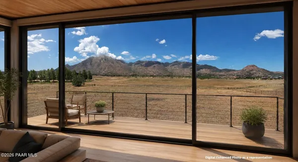 a view of a balcony with floor to ceiling windows with wooden floor
