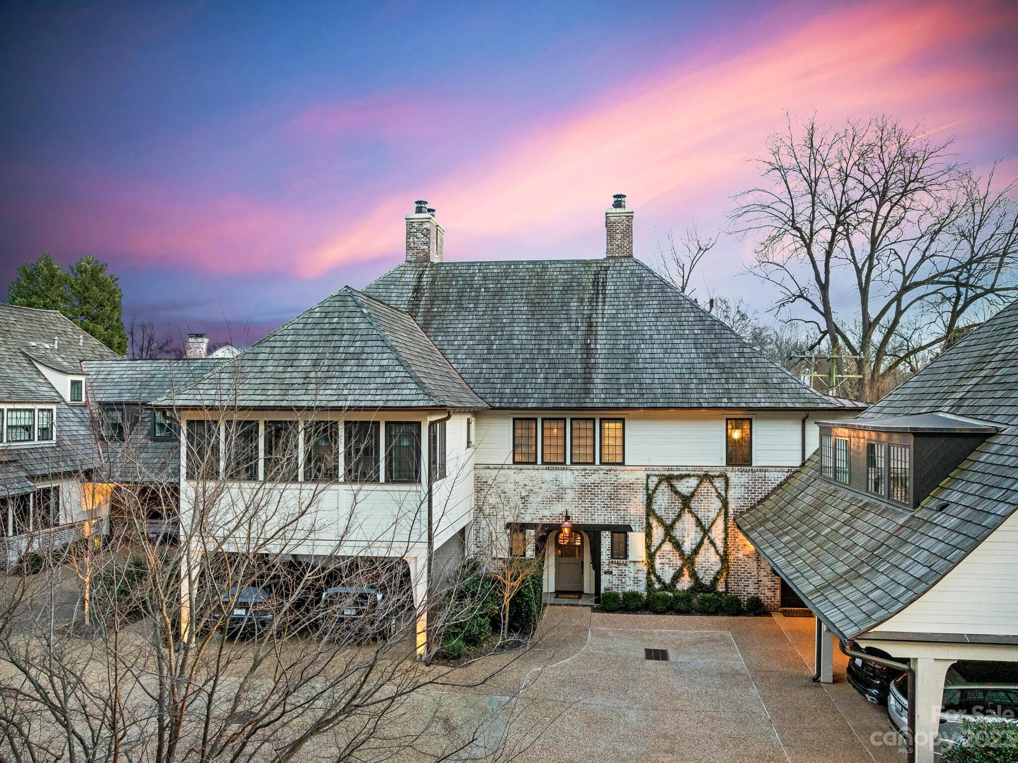 1200 Queens Road Charlotte, NC 28207 - Photo 1 of 42 a view of a house with wooden deck and furniture