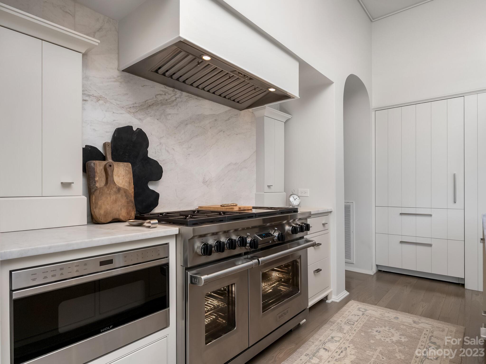 1200 Queens Road Charlotte, NC 28207 - Photo 11 of 42 a stove top oven sitting inside of a kitchen