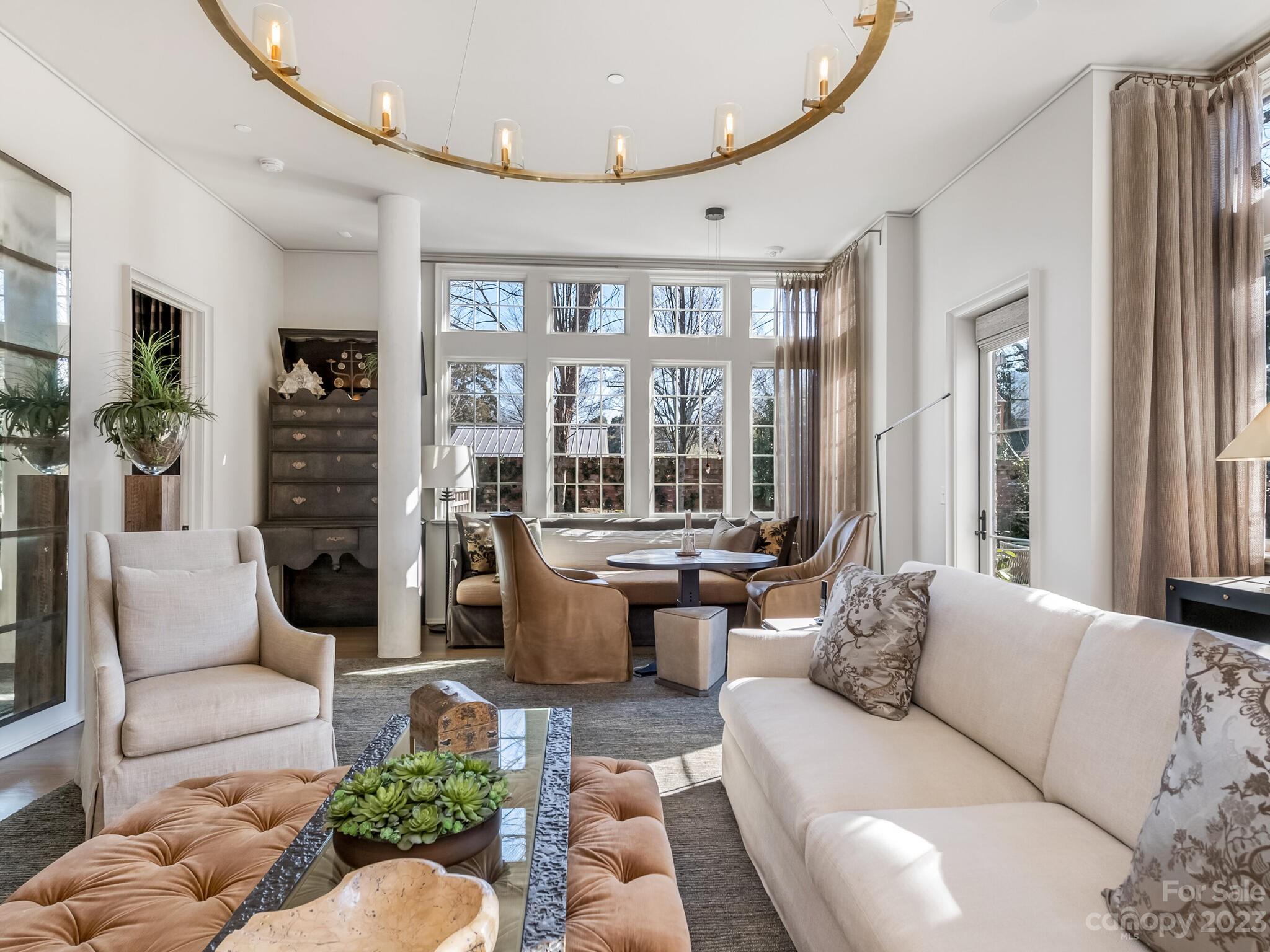 1200 Queens Road Charlotte, NC 28207 - Photo 16 of 42 a living room with furniture fireplace and a large window