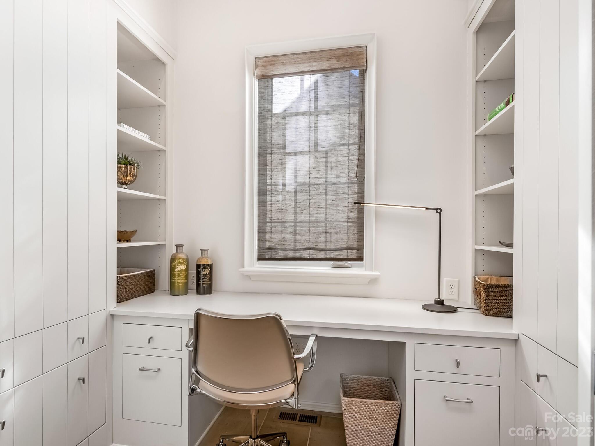 1200 Queens Road Charlotte, NC 28207 - Photo 17 of 42 a kitchen with a sink cabinets and a window
